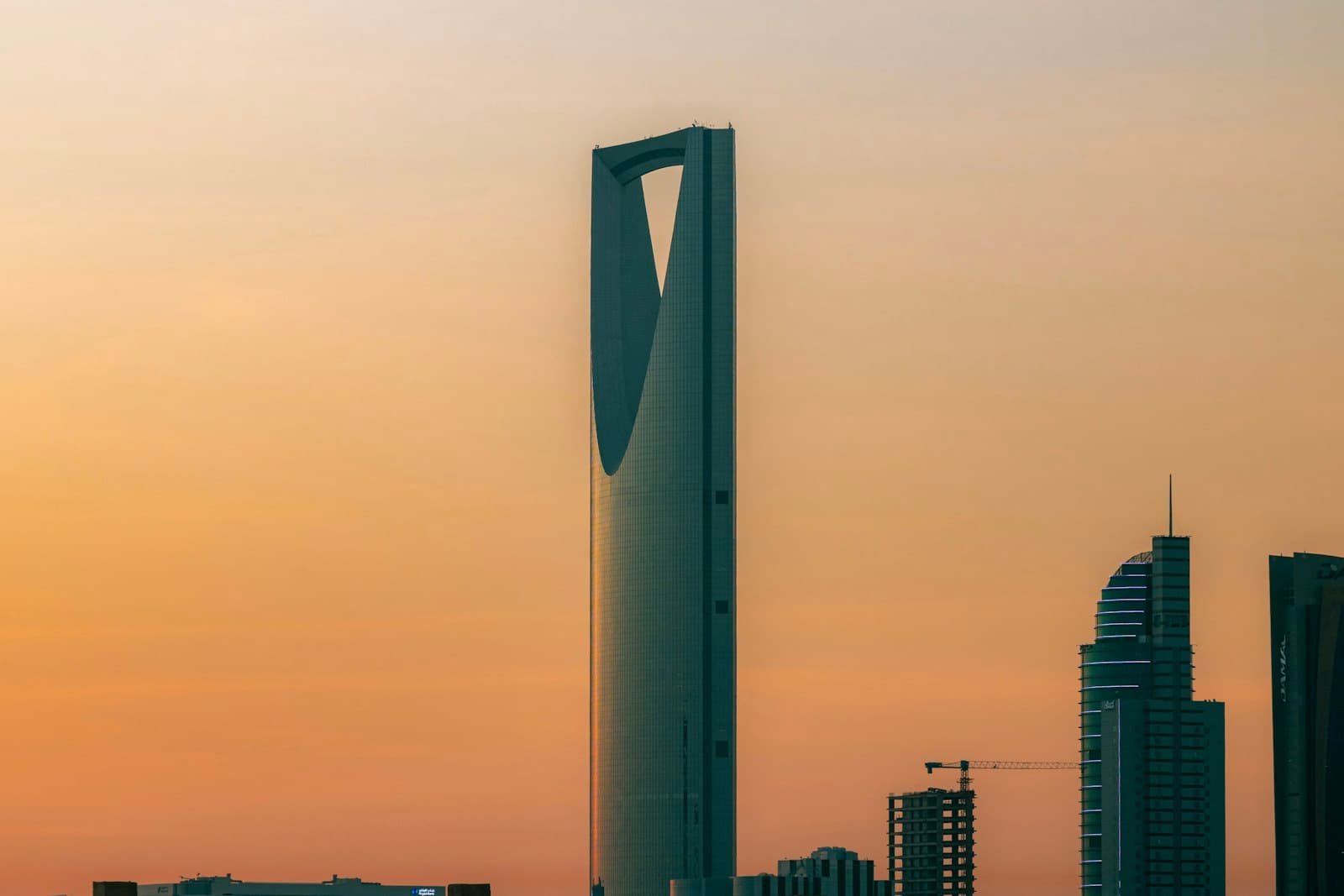 The Kingdom Centre tower in Riyadh against a warm evening sky