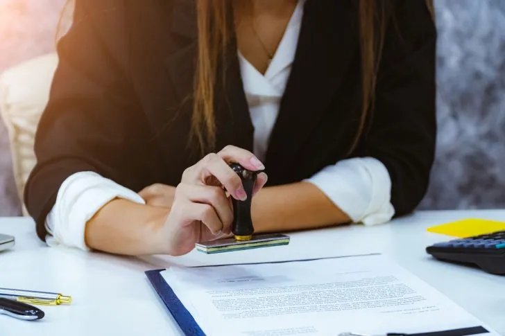 Businessperson looking at a certificate of incorporation with apostille attached